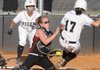 Springdale High catcher Misty Hickman tags out Bentonville’s Kaitlin Spurgeon-Long in the third inning Tuesday at the Tiger Athletic Complex in Bentonville. Go to <a href="http://photos.nwaonline.com">photos.nwaonline.com</a> for more photos.