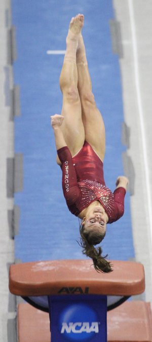 Oklahoma gymnast Sara Stone spins during her vault routine at the NCAA Gymnastics Championships on Friday. Oklahoma, along with five other teams, advanced to today’s Super Six championship round.

