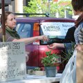 Kim Kapity sells eggs on Thursday at the Fayetteville Farmers’ Market to Wendy Mercer of Durham. Kap...