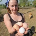Kim Kapity holds a variety of eggs on April 7 at her farm in Washington County.