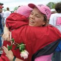 Sue White, right, of Fayetteville, hugs volunteer Judy Rogers following White’s finish at a past Rac...