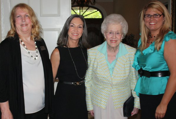 
                               
                                  Photo by Carin Schoppmeyer&mdash;
                               
                           
                           Elizabeth Richardson Center Communications Director Lynne Keller, from left, Debbie Walker, Pat Walker and Mandy Macke gather at the center’s Pillars & Pioneers Awards Dinner on Tuesday evening.

