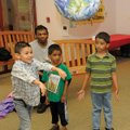 EARTH DAY ACTIVITIES Daelen Deleon, 6, left, tosses a globe for others to catch Saturday to see if t...