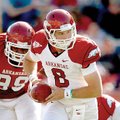 White quarterback Tyler Wilson looks to hand off the ball during the Arkansas Red-White Spring Game ...