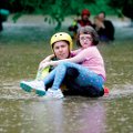Rescue teams evacuate residents of the Oak Glen mobile home park in Johnson on Monday as rain contin...