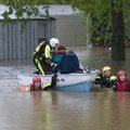 A water rescue team works Monday to evacuate residents from the Oak Glen manufactured housing park i...