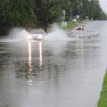 A car drives East on Poplar Street just west of Eighth Street Monday April 25, 2011 in Rogers. Heavy...
