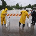 Tim Burton, Gene Burton and Wayne Terry of the Springdale Street Department put up a barricade on Sa...