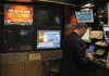  The announcement that the Federal Open Market Committee would leave interest rates unchanged goes largely unnoticed in the Credit Suisse booth on the floor of the New York Stock Exchange, Wednesday, April 27, 2011, in New York. 