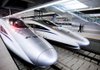  A police officer walks past a new high-speed inter-city train that connects Shanghai and Hangzhou in Shanghai, China on Tuesday, Oct. 26, 2010. The Shanghai-Hangzhou high-speed railway started operating today, shortening the travel time from 1.5 hours to 45 minutes. Photographer: Qilai Shen/Bloomberg