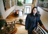  Zar Zanganeh, a realtor with Luxe Estates Collection, stands for a photograph in the foyer of a luxury home previously owned by actor Nicolas Cage in Las Vegas, Nevada, U.S., on Wednesday, April 20, 2011. A growing number of high-end homes are selling at a loss or facing repossession by lenders in Las Vegas, which already has the highest rate of foreclosure filings among large U.S. cities. Photographer: Ronda Churchill/Bloomberg Zar Zanganeh

