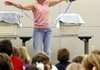 Lynn Sciumbato of Morning Star Wildlife Rehabilitation Center talks about Igor, a turkey vulture, to children during a presentation at the Rogers Public Library. Sciumbato will speak this weekend at Devil’s Den State Park near West Fork.
