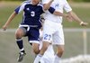 Rogers High’s Humberto Jimenez, right, and Rogers Heritage’s Saul Lopez jump for a header Friday during the Mounties’ 4-2 win against the War Eagles in Mountie Stadium in Rogers. The Lady Mounties won 1-0. For more photos, go to photos.nwaonline.com.