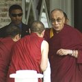 The Dalai Lama, right, greets Tibetan monks Tuesday at Carnall Hall at the University of Arkansas ca...