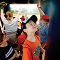 Tyson Elementary student Maggie Cebuhar, 11, of Springdale cools off Tuesday in the mist machine at ...