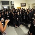 Michelle O’Brien, left, a volunteer with Bentonville High School’s scholarship office, gives seniors...