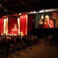 The Dalai Lama walks on stage at the University of Arkansas in Fayetteville as Chancellor Gearhart p...