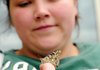 Patricia Howard holds a butterfly before releasing it in memory of a daughter she lost to miscarriage. The organization known as Share hosted the butterfly release as part of a spring remembrance service at Mercy Medical Center in Rogers.
