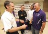 New Fayetteville girls basketball coach Vic Rimmer, left, speaks on May 13 with his predecessor, Bobby Smith, right, as friend Jimmy Dykes, center left, and Fayetteville boys assistant head coach Tommy Deffebaugh laugh before a ceremony to announce Rimmer’s hiring.