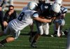 Springdale Har-Ber senior Preston Pianalto (5) is tackled by senior Seth Banks (8) during the spring game Thursday May 26, 2011 at the Har-Ber practice field in Springdale. Visit http://photos.nwaonline.com/ to see more photos.