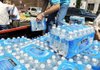  Daniel Sweeney, of Tulsa, Okla., a member of Believers Church, stacks cases of water onto the back of a pickup truck Friday, May 27, 2011, in the parking lot of Central Christian Church in downtown Joplin, Mo.  At least 126 people were killed and hundreds more injured when a tornado cut a destructive path through Joplin on Sunday evening. 