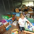 J.P. Peters, vice president of the Fayetteville Council of Neighborhoods, sorts donated items Tuesda...