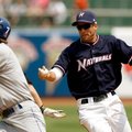 Northwest Arkansas shortstop Jeff Bianchi, right, tries to tag out Tulsa’s Tim Wheeler in a run down...