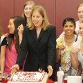 Springdale High’s new girls basketball coach, Heather Hunsucker, middle, smiles following a news con...