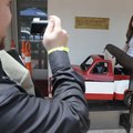 Misty McFerrin, of Gillette, Wyo., has her photograph taken Wednesday on the toy truck ride in front...