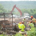 Workers prepare to pour the first of the piers that will support a bridge meant to replace the Tilly...