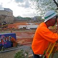 Bill Womack uses a digital theodolite Wednesday to survey the site of the new Fayetteville High Scho...