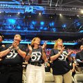 ASSOCIATES RALLY Walmart associates from Store No. 59 in Joplin, Mo. stand together to watch the Wal...