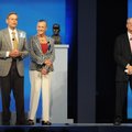 Jim Walton, from left, speaks during the shareholders meeting as sister Alice Walton and brother Rob...