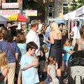 FIRST FRIDAY People move onto the square for First Friday in downtown Bentonville. Friday was the ki...