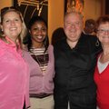 Jen Calleja, from left, and Jocelyn Jimmerson visit with Ed and Kathy McClure at the Rogers Little T...
