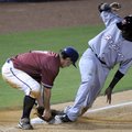 Northwest Arkansas’ Kurt Mertins, left, loses the ball as Frisco’s Engle Beltre slides safely into t...