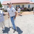 Dale “Lee” Walker Jr. speaks on Saturday with Belva Lee, whose husband served with Walker during the...