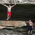 Miguel Sandobal, 11, of Fort Smith watches as friend Israel Rodriguez, 15, of Fort Smith cools off S...