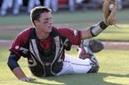  Arkansas catcher James McCann holds up the ball to show the out off the bat of Arizona State's Joey DeMichele during the third inning of an NCAA baseball regional playoff game at Packard Stadium Sunday, June 5, 2011 in Tempe, Ariz. 