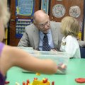 Mike Mumma, the retiring principal of Mary Mae Jones Elementary School, talks with Cyric Day, 5, in ...