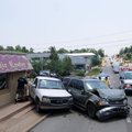 Jeffrey McDaniel of Springdale tries to get into his vehicle Monday after an accident at the interse...