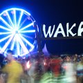 People walk through the Wakarusa 2011 Festival grounds near Ozark, Ark. Friday, June 3, 2011. The la...