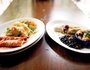 Enchilada dishes with tacos, rice, black beans and roasted potatoes.