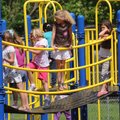 First-graders and kindergartners play outdoors Monday during recess at Westside Elementary School in...