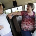 Susie Dover, right, talks Wednesday to Madison McKinney, 9, before departing on her final afternoon ...