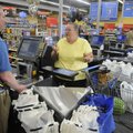 Lavern Golden, right, of Gentry, talks Wednesday with Walmart Express employee Richard Alexander abo...