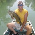 Kings River fishing guide Jeff Fletcher of Eagle Rock, Mo., shows one of more than 100 smallmouth ba...