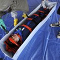Disaster actor Thanh Nguyen is washed by emergency room nurse Jill Brown at a primary decontaminatio...