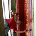 PAINTING PROJECT Tim Fitzhugh, owner of Noah’s Ark Painting in Springdale, paints the sign on the fr...
