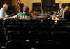 Property Owners Association board members George DeGroot, left, Jim Parsons, second right, and Steve Morrow, right, listen Thursday to tape recordings from two board meetings during an open hearing at the Bella Vista County Club. Also listening is Bella Vista resident Leon Huff.
